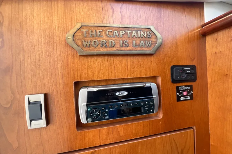 Slide: The Image of 2001 Cruisers Yachts 3672 Express interior with audio system and captain's sign. - 32