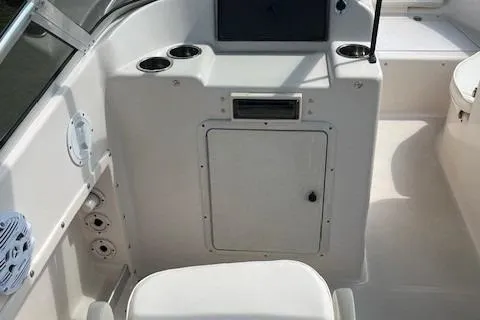 Slide: The Image of 1996 Scout 202 Dorado boat interior with seating and control panel. - 11