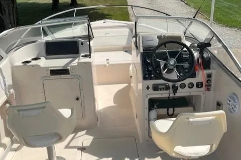 Slide: The Image of 1996 Scout 202 Dorado boat cockpit with dual seats and steering console. - 13