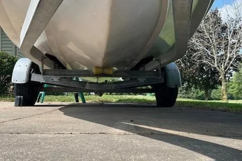 Slide: The Image of Underneath view of a 1996 Scout 202 Dorado boat on a trailer. - 7