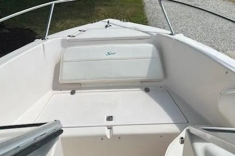 Slide: The Image of 1996 Scout 202 Dorado boat interior with seating and storage. - 8