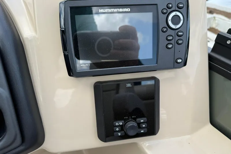 Slide: The Image of Control panel of 2026 Bentley Pontoons Legacy 243 Navigator with Humminbird and JBL systems. - 6