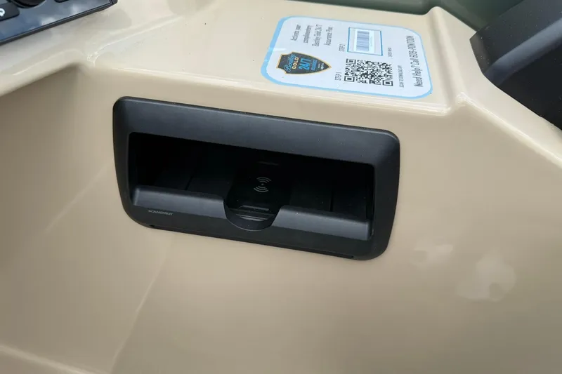 Slide: The Image of 2026 Bentley Pontoons Legacy 243 Navigator dashboard with wireless charging dock and QR code. - 7