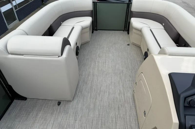 Slide: The Image of Interior of 2026 Bentley Pontoons Legacy 243 Navigator with plush seating and modern design. - 8