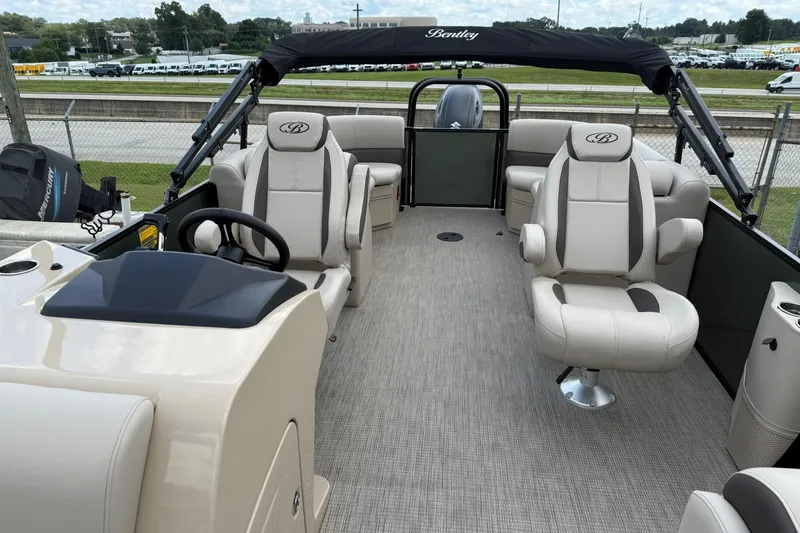 Slide: The Image of 2026 Bentley Pontoons Legacy 243 Navigator interior with luxurious seating and modern design. - 9