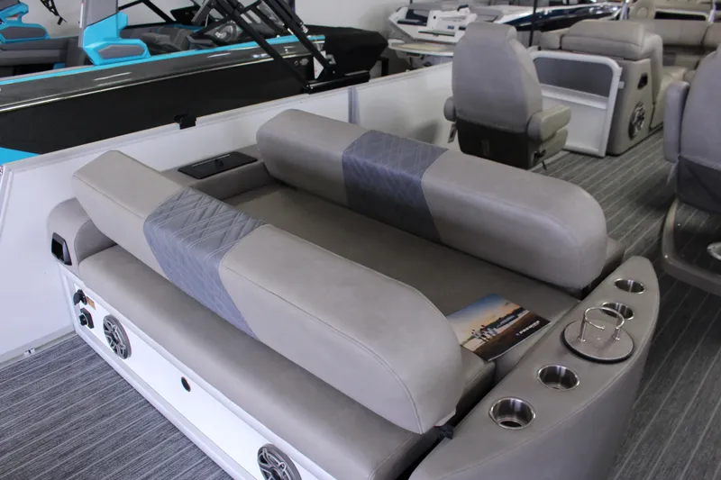 Slide: The Image of 2023 Premier 250 Intrigue boat interior with luxurious seating and cup holders. - 15