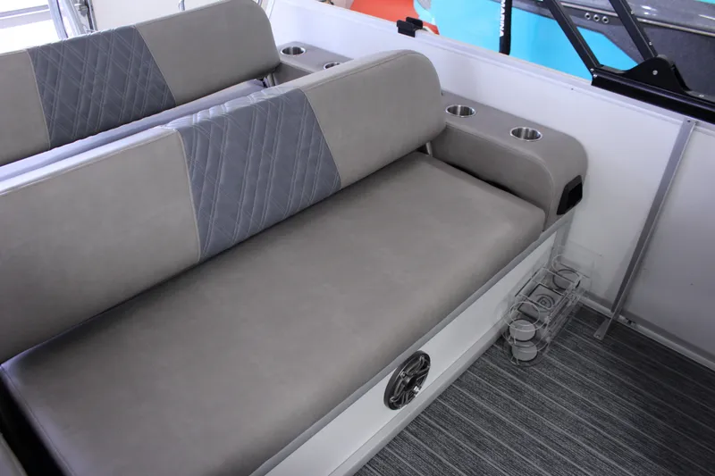 Slide: The Image of 2023 Premier 250 Intrigue boat interior with gray seating and cup holders. - 17