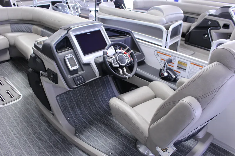 Slide: The Image of 2023 Premier 250 Intrigue boat interior with modern helm and luxurious seating. - 19