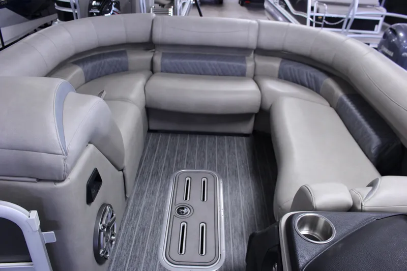 Slide: The Image of Luxurious seating area in 2023 Premier 250 Intrigue pontoon boat interior. - 24