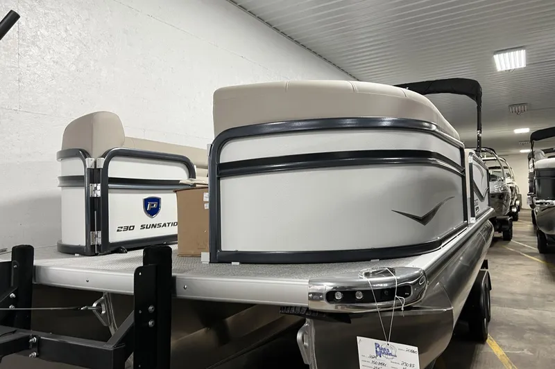 Slide: The Image of 2023 Premier 250 Intrigue pontoon boat in indoor storage facility. - 25