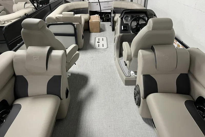 Slide: The Image of 2023 Premier 250 Intrigue boat interior with luxurious seating and modern dashboard. - 26