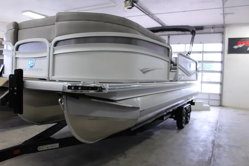 Slide: The Image of 2023 Premier 250 Intrigue pontoon boat in a garage setting. - 6