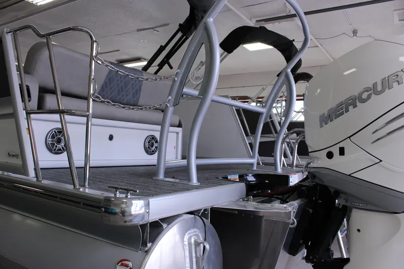 Slide: The Image of 2023 Premier 250 Intrigue pontoon boat with Mercury engine, featuring sleek design and modern seating. - 9
