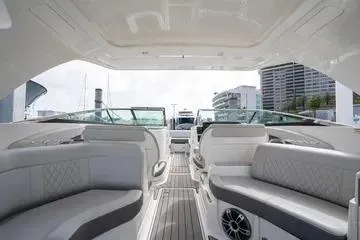 Slide: The Image of 2023 Sea Ray SLX 350 Outboard interior with luxurious seating and modern design. - 11