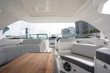 Slide: The Image of 2023 Sea Ray SLX 350 Outboard interior with luxurious seating and modern design. - 13