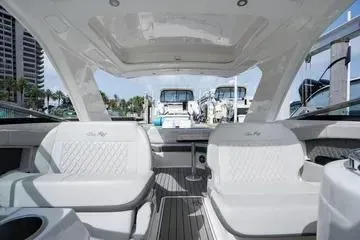 Slide: The Image of 2023 Sea Ray SLX 350 Outboard interior with luxurious seating and modern design. - 20