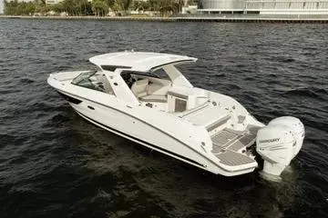 Slide: The Image of 2023 Sea Ray SLX 350 Outboard boat on water, showcasing sleek design and powerful engine. - 5