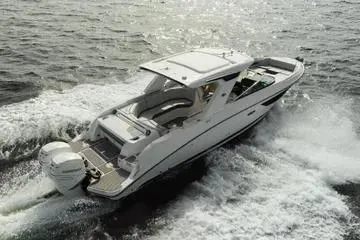 Slide: The Image of 2023 Sea Ray SLX 350 Outboard cruising on open water, showcasing sleek design and powerful performance. - 6