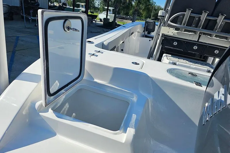 Slide: The Image of 2025 Sea Pro 222 Center Console boat interior with open storage compartment. - 10