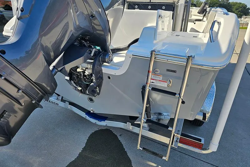 Slide: The Image of 2025 Sea Pro 222 Center Console boat with outboard motor and ladder. - 12