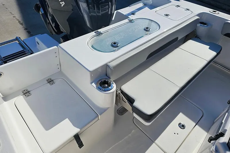 Slide: The Image of 2025 Sea Pro 222 Center Console boat interior with seating and storage features. - 13
