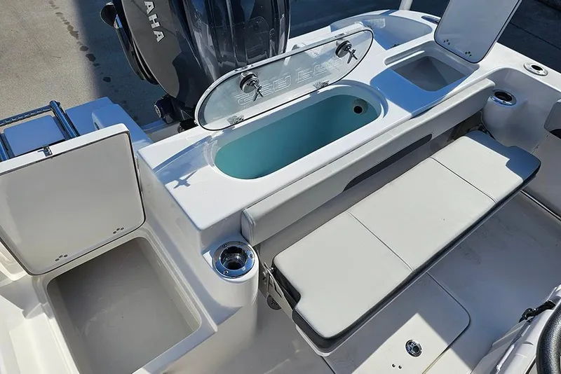 Slide: The Image of 2025 Sea Pro 222 Center Console boat interior with seating and storage compartments. - 14