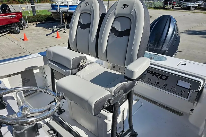 Slide: The Image of 2025 Sea Pro 222 Center Console boat interior with dual seats and steering wheel. - 19