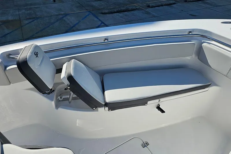 Slide: The Image of 2025 Sea Pro 222 Center Console boat interior with cushioned seating. - 28