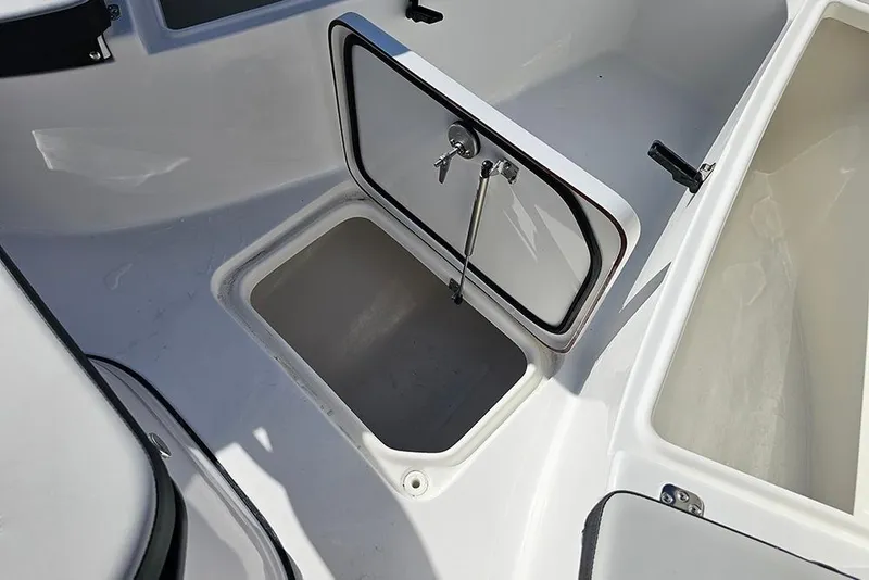 Slide: The Image of 2025 Sea Pro 222 Center Console storage compartment with open hatch. - 30