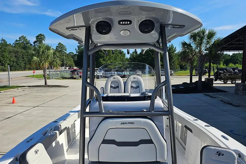 Slide: The Image of 2025 Sea Pro 222 Center Console boat with T-top, parked outdoors. - 33