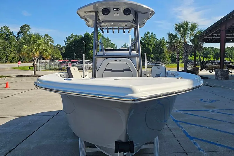 Slide: The Image of 2025 Sea Pro 222 Center Console boat in a sunny outdoor setting. - 4