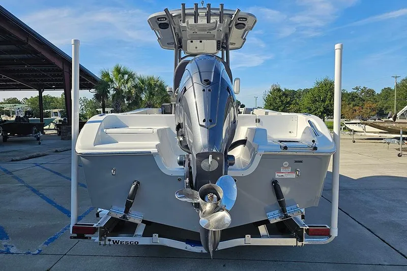 Slide: The Image of 2025 Sea Pro 222 Center Console boat with powerful outboard motor, parked on trailer. - 8