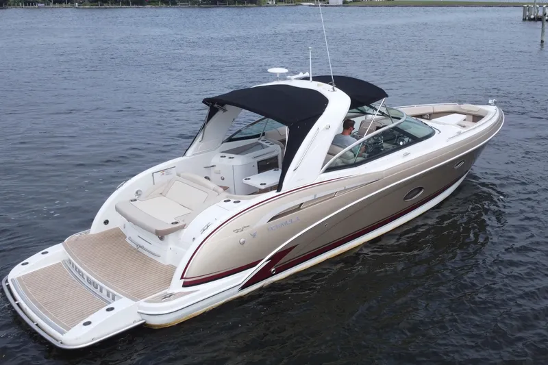 The Image of 2013 Formula 350 CBR boat cruising on calm water, featuring sleek design and spacious deck. - 1