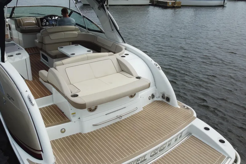 Slide: The Image of 2013 Formula 350 CBR boat with spacious seating on calm water. - 13
