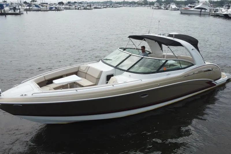 Slide: The Image of 2013 Formula 350 CBR boat cruising on a calm marina waterway. - 14