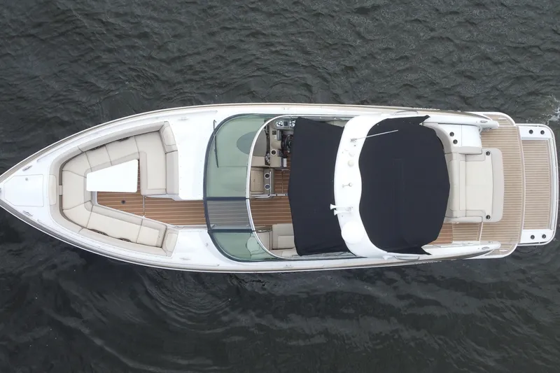 Slide: The Image of Overhead view of 2013 Formula 350 CBR boat on water, featuring spacious seating and sleek design. - 17