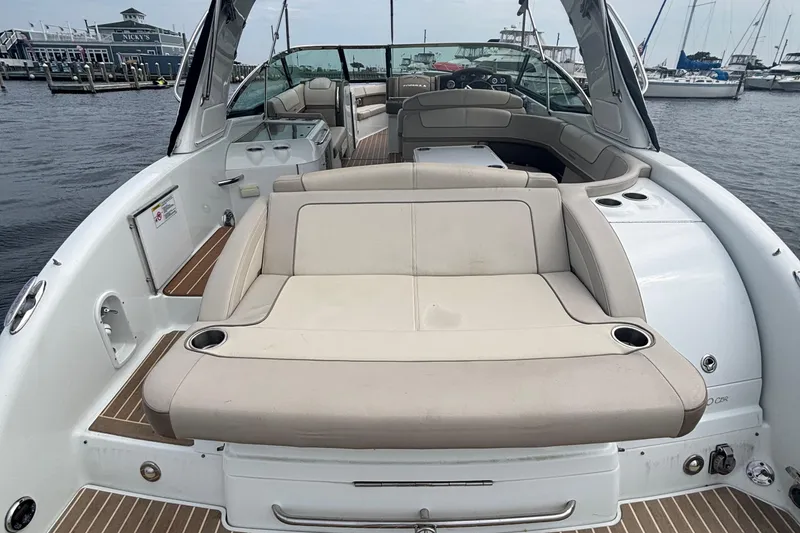 Slide: The Image of 2013 Formula 350 CBR boat interior with beige seating, docked at marina. - 19