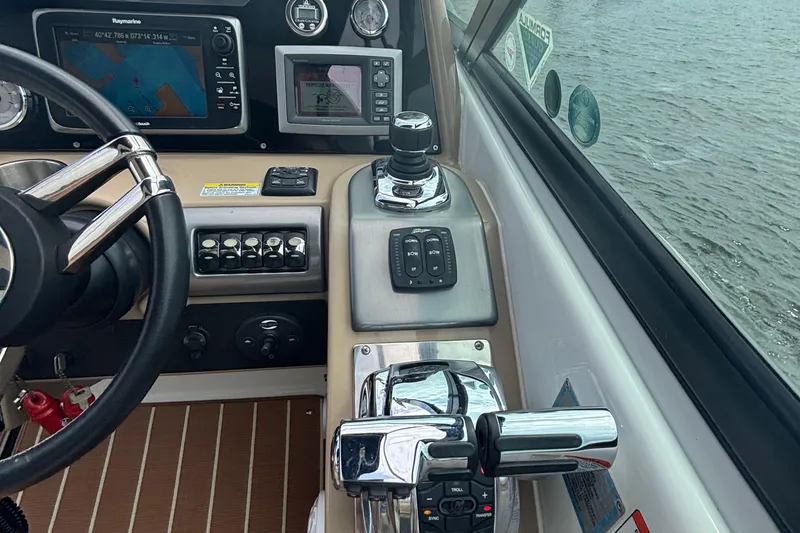 Slide: The Image of Control panel of a 2013 Formula 350 CBR boat with navigation equipment. - 25
