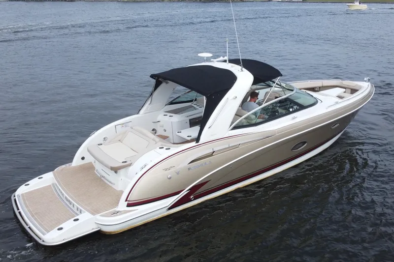 Slide: The Image of 2013 Formula 350 CBR boat cruising on open water, featuring sleek design and spacious deck. - 3
