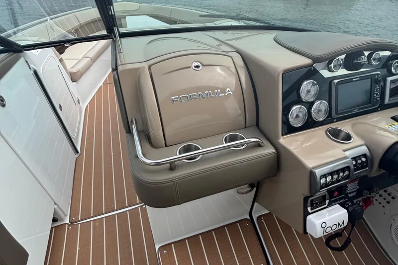 Slide: The Image of 2013 Formula 350 CBR boat cockpit with modern dashboard and seating. - 31