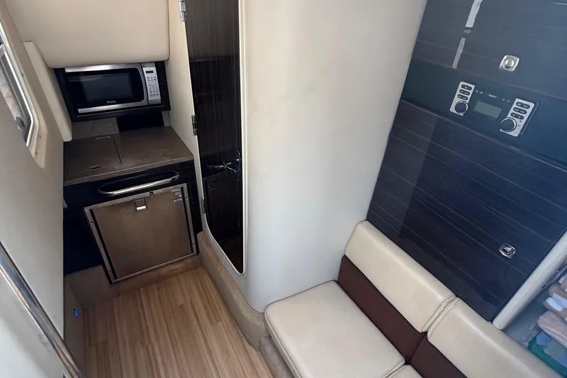 Slide: The Image of Interior of 2013 Formula 350 CBR boat with kitchenette and seating area. - 40