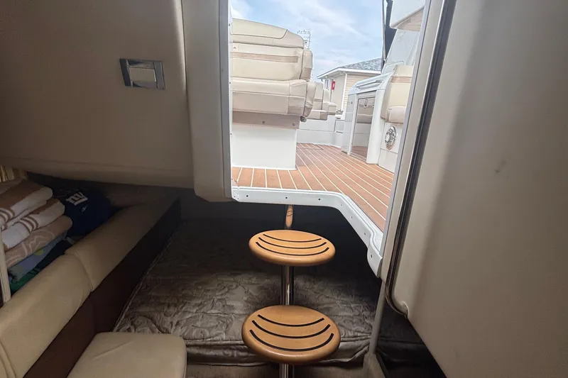 Slide: The Image of Interior view of 2013 Formula 350 CBR boat with wooden steps and seating area. - 44