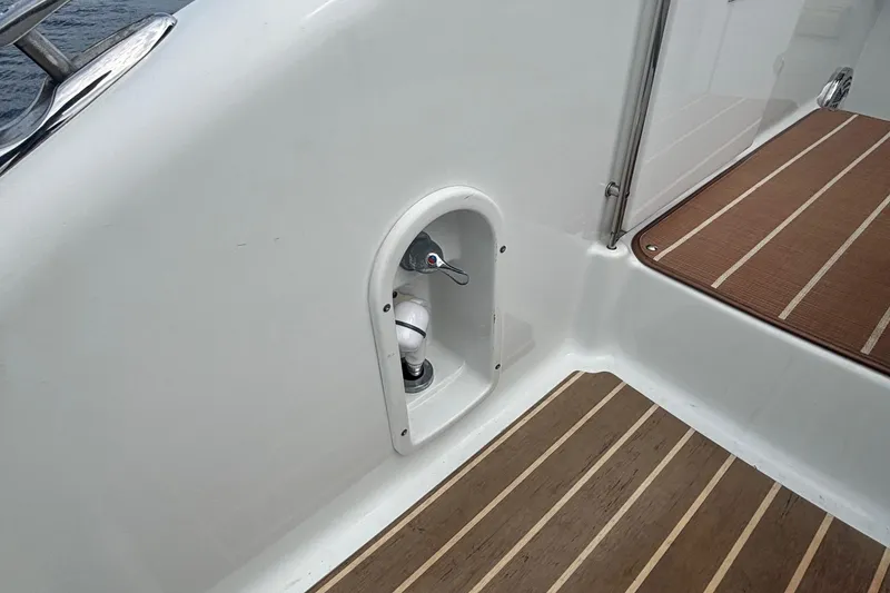 Slide: The Image of 2013 Formula 350 CBR boat deck with wood flooring and compartment. - 53