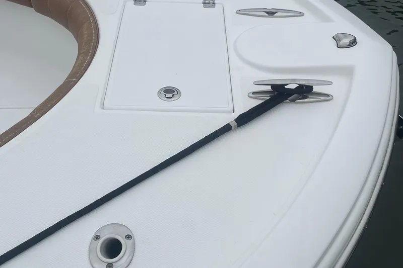 Slide: The Image of 2016 Buddy Davis 28 Center Console boat deck with cleat and rope. - 21