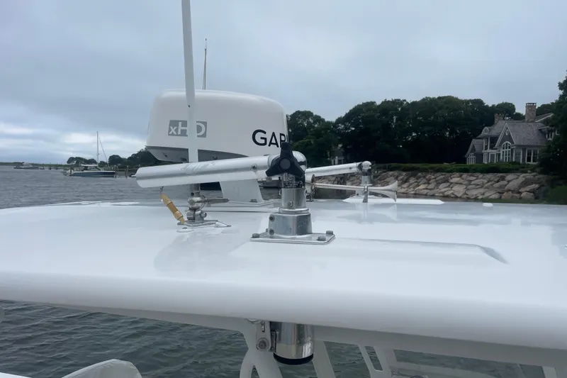 Slide: The Image of 2016 Buddy Davis 28 Center Console boat with radar equipment on calm water. - 23