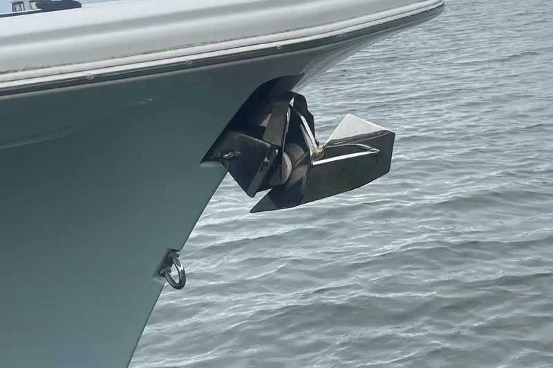 Slide: The Image of Bow of 2016 Buddy Davis 28 Center Console with anchor over water. - 24