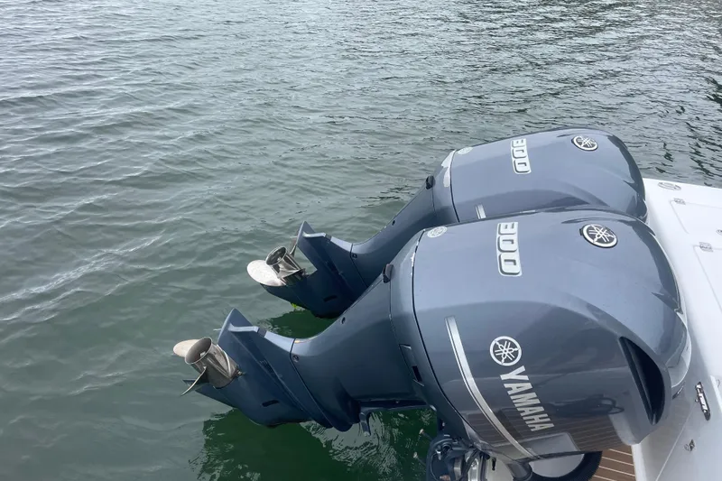 Slide: The Image of Twin Yamaha outboard engines on a 2016 Buddy Davis 28 Center Console boat. - 25