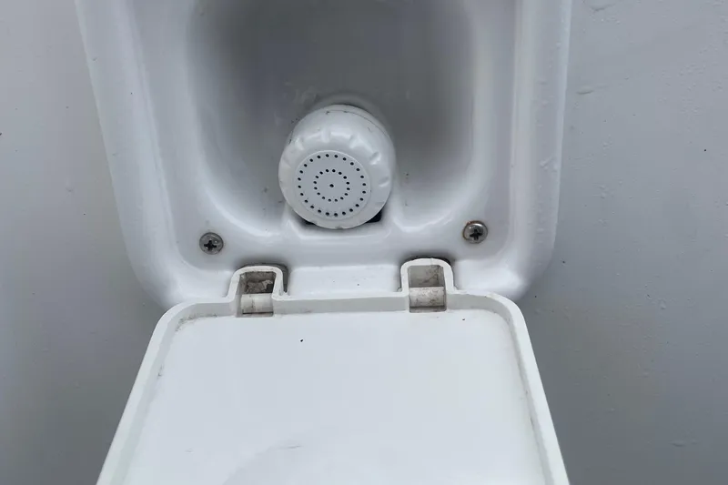 Slide: The Image of Close-up of a 2016 Buddy Davis 28 Center Console boat's water outlet. - 5