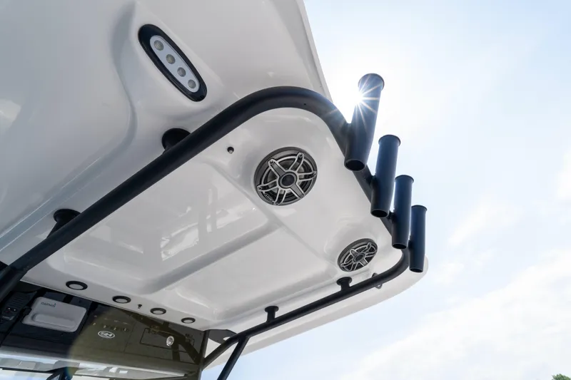 Slide: The Image of 2026 Sea Hunt Ultra 255 SE boat roof with speakers and rod holders. - 18