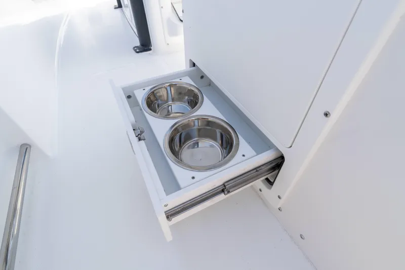 Slide: The Image of Pull-out pet bowls on 2026 Sea Hunt Ultra 255 SE boat. - 6